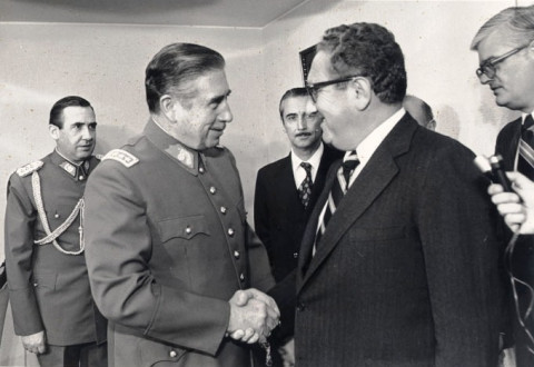U.S. Secretary of State Henry Kissinger shaking hands with Pinochet in 1976