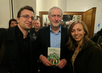 Jeremy Corbyn receiving the book Reclaiming public services
