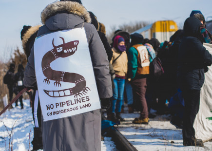 No Pipelines graphic on the back of land defender at blockade of railyard in Vaughan, Toronto, Ontario in February 2020. Photo by @jasonhargrove